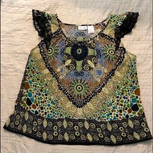 Forbidden sleeveless blouse with intricate design
